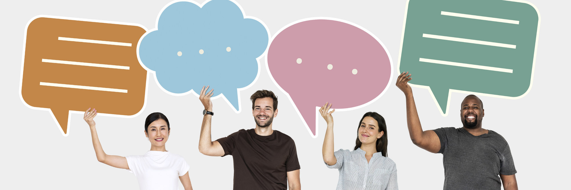 People holding speech bubble signs